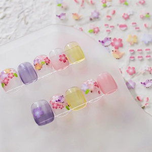 Floral nail stickers set featuring cherry blossoms and bird patterns in pastel colors