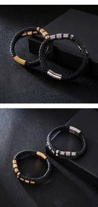 Macro shot of men's braided leather bracelet with gold and silver magnetic metal clasps