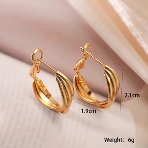 Detail view of gold hoop earrings with dimensions 2.1cm x 1.9cm and 6g weight