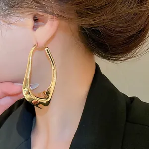 Chic gold irregular geometric hoop earrings with hollow design for a minimalist stylish look