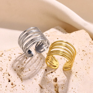 Close-up of gold and silver multi-layer open rings with a hollow minimalist design