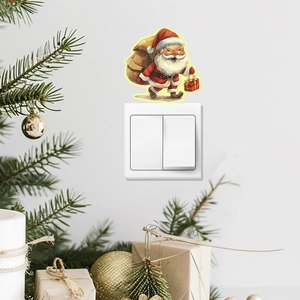 Luminous Santa Claus wall sticker for light switch in festive Christmas bedroom setting