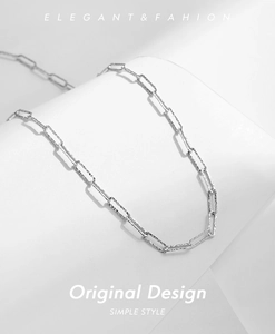 Detailed close-up of S925 sterling silver paperclip chain with irregular hammered texture