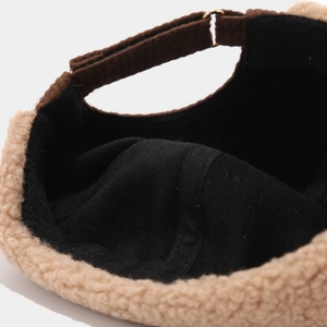 Detail of winter docker hat showing sherpa lining and corduroy adjustable strap