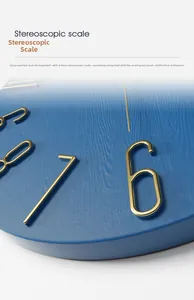 Detail of matte blue wall clock with 4mm golden 3D numbers and fine wood grain texture