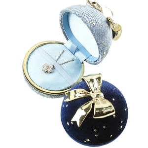 Starry velvet jewelry box with golden bow for rings and necklaces in festive style