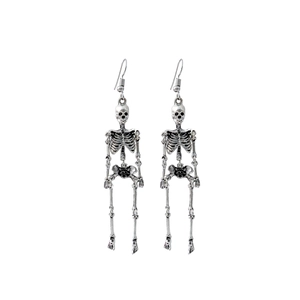 Macro shot of vintage silver skeleton earrings showing punk skull design details