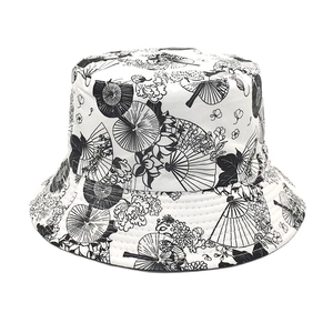 Detail of cotton canvas bucket hat with traditional black fan and floral pattern print