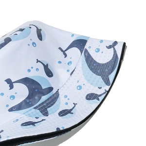 Detail of high-density stitching and dolphin whale prints on a summer bucket hat