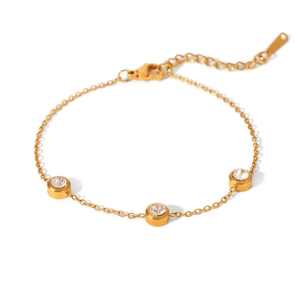 Close-up of 18K gold plated bracelet featuring three bezel-set cubic zirconia stones