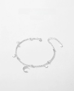 Detail of s925 silver double-layer bracelet featuring zircon star and moon charms