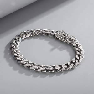Detail of silver Cuban link bracelet with sparkling cubic zirconia encrusted clasp