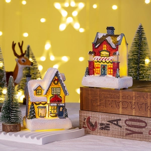 LED lighted Christmas resin house miniature with warm glow and snowy shop details