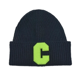Navy blue ribbed knit beanie featuring a vibrant green letter C patch for winter warmth