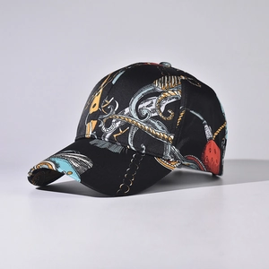 Detail of satin baseball cap featuring intricate classical chain and crest pattern prints