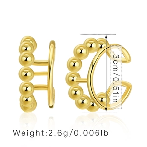Detailed view of C-shaped 18K gold-plated ear cuffs with three-row beaded metal texture