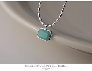 Close-up of S925 sterling silver chain with a rectangular turquoise stone pendant