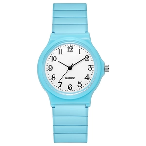 Macro shot of sky blue quartz watch with round dial and black Arabic numeral markers