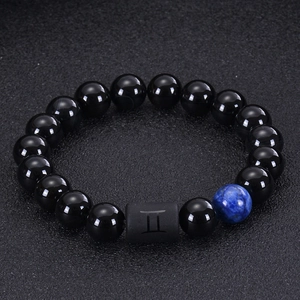 Gemini zodiac bead bracelet featuring black onyx, tiger eye stones and a blue textured bead