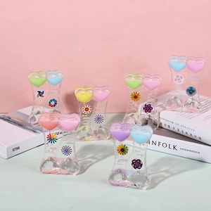 Detail of heart-shaped liquid motion timers with colorful oil droplets and floating toys