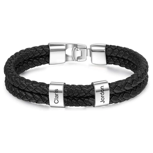 Detail of double-layer black leather bracelet with custom engraved stainless steel beads