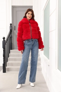 Short red faux fur jacket with fluffy texture and full-zip closure shown on model