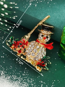 Detailed view of rhinestone snowman brooch with 4.8cm height and 4.7cm width dimensions