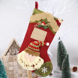 Close-up of Santa Claus Christmas stocking with felt embroidery and rustic hemp fabric textures