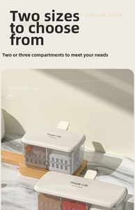 Detail view of seasoning box set with transparent jars and wooden base for kitchen storage