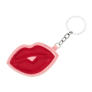 Red and pink leather lip-shaped keychain with silver metal ring on white background