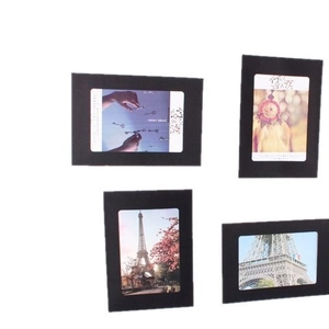Set of 4 black vintage kraft paper hanging photo frames with various sizes on white background