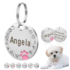 Custom round stainless steel pet ID tags with rhinestone paws and laser engraving