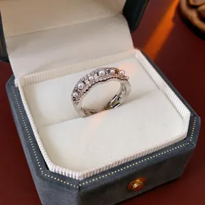 Elegant wave-shaped pearl open ring with zircons and silver finish for women