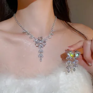 Luxurious zircon flower and wheat tassel necklace and earring set shown on model