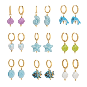Set of 9 pairs of gold stainless steel hoop earrings with ocean ceramic pendants
