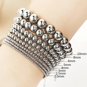 Detailed comparison of various stainless steel bead sizes from 2mm to 10mm on wrist