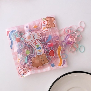 Close-up of pastel macaron high-elastic hair ties in cute cartoon bear packaging