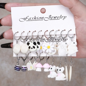 Cute resin earrings set featuring panda, daisy, and mushroom charms on display card