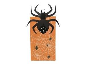 Detail of orange Halloween paper bag with 3D spider cutout and printed web patterns
