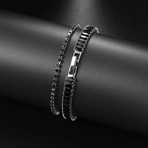 Detailed close-up of hip hop tennis bracelets with black rectangle and round zircons