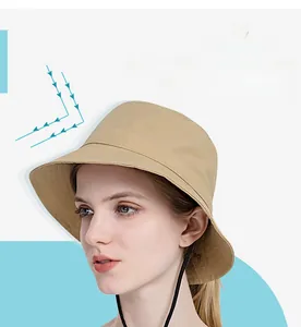 Close-up of beige nylon sun hat with chin strap and high-density sun protection fabric