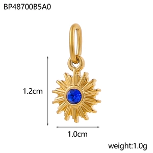 Detailed view of sun-shaped gold pendant with blue gemstone inlay and size dimensions