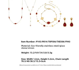 Detalle de set de joyas en acero bañado en oro 18k con piedras rojas de cristal y circón