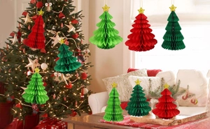 Detailed view of honeycomb paper Christmas tree decorations with gold stars in three colors