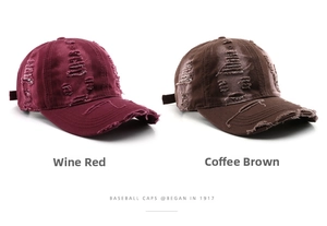 Detail of distressed baseball caps in wine red and coffee colors with frayed hole effects