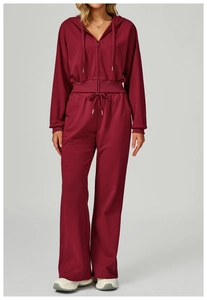 Full view of burgundy high-waisted wide-leg sweatpants and zip-up drawstring hoodie set