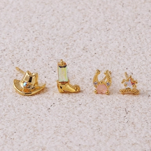 Golden cowboy jewelry set featuring western boots, hat, and horseshoe studs with opals