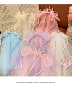 Detail view of colorful girls crown headbands with glitter lace veils and bow ears