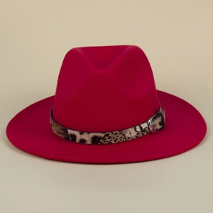 Detail of red fedora hat featuring a stylish leopard print band and metal buckle strap