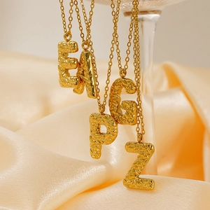 Lava texture gold alphabet pendant necklaces for women with elegant hammered metal finish